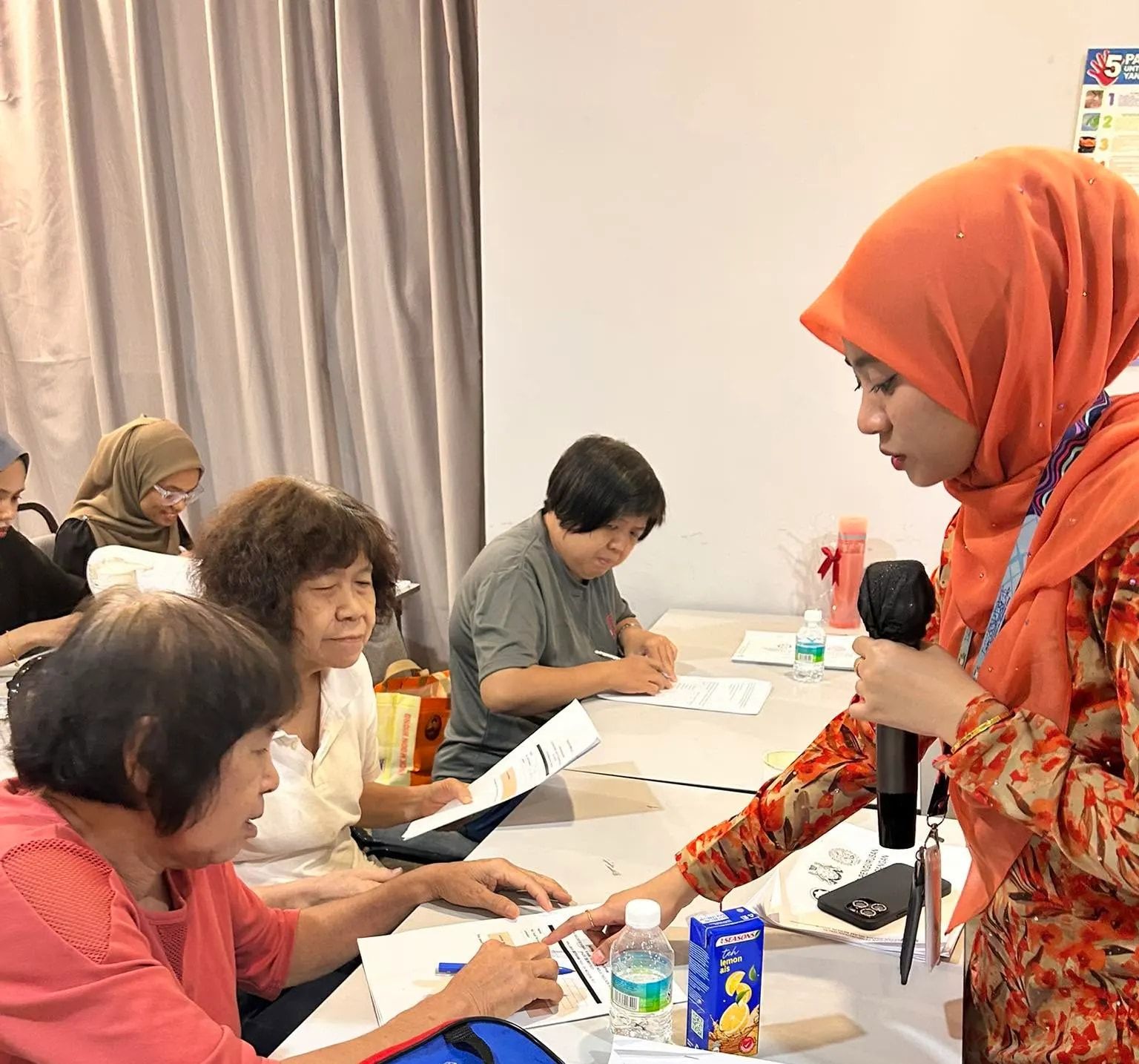 A consultant guiding participants through their documents during a workshop